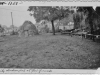 " print of tule hut and parked cars. Back says "1950 Lake Co