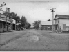 7 photo of main street with Polk's Grocery and Odd Fellows