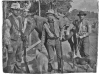 photo of 3 men, 2 dogs, and a horse with Winchester rifles and