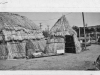 " print of tule huts. Back says "1950 at fair - built by Henry